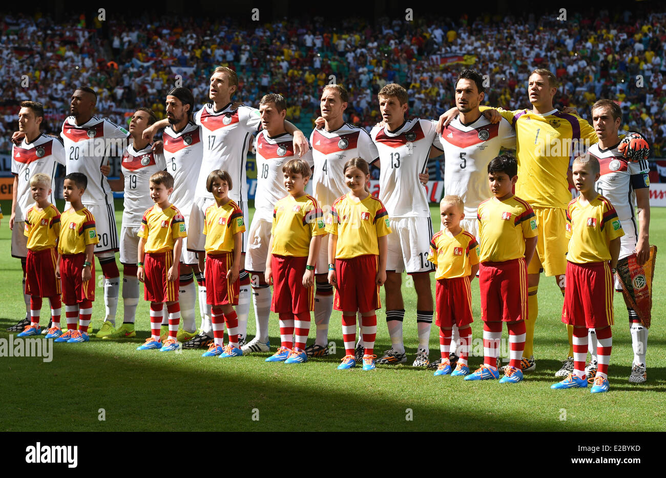 German team stand during the national anthem prior to the kick-off of the FIFA World Cup 2014 group G preliminary round match between Germany and Portugal at the Arena Fonte Nova Stadium in Salvador da Bahia, Brazil, 16 June 2014 (R-L): Philipp Lahm, Manuel Neuer, Mats Hummels, Thomas Mueller, Benedikt Hoewedes, Toni Kroos, Per Mertesacker, Sami Khedira, Mario Goetze, Jerome Boateng, Mesut Oezil. Photo: Marcus Brandt/dpa Stock Photo