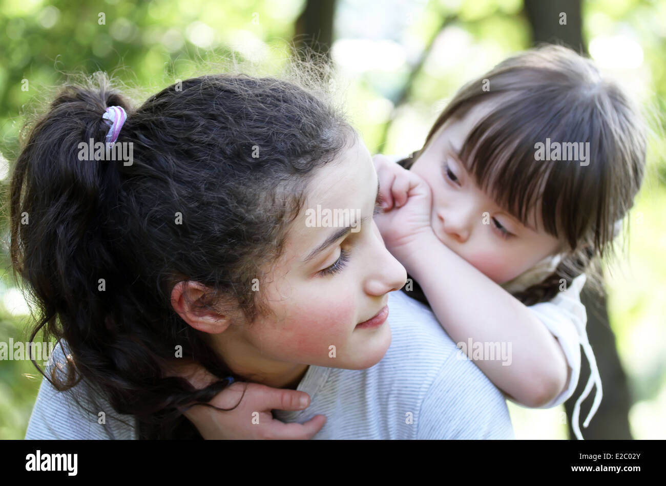 Portrait of beautiful young girls in the park Stock Photo - Alamy