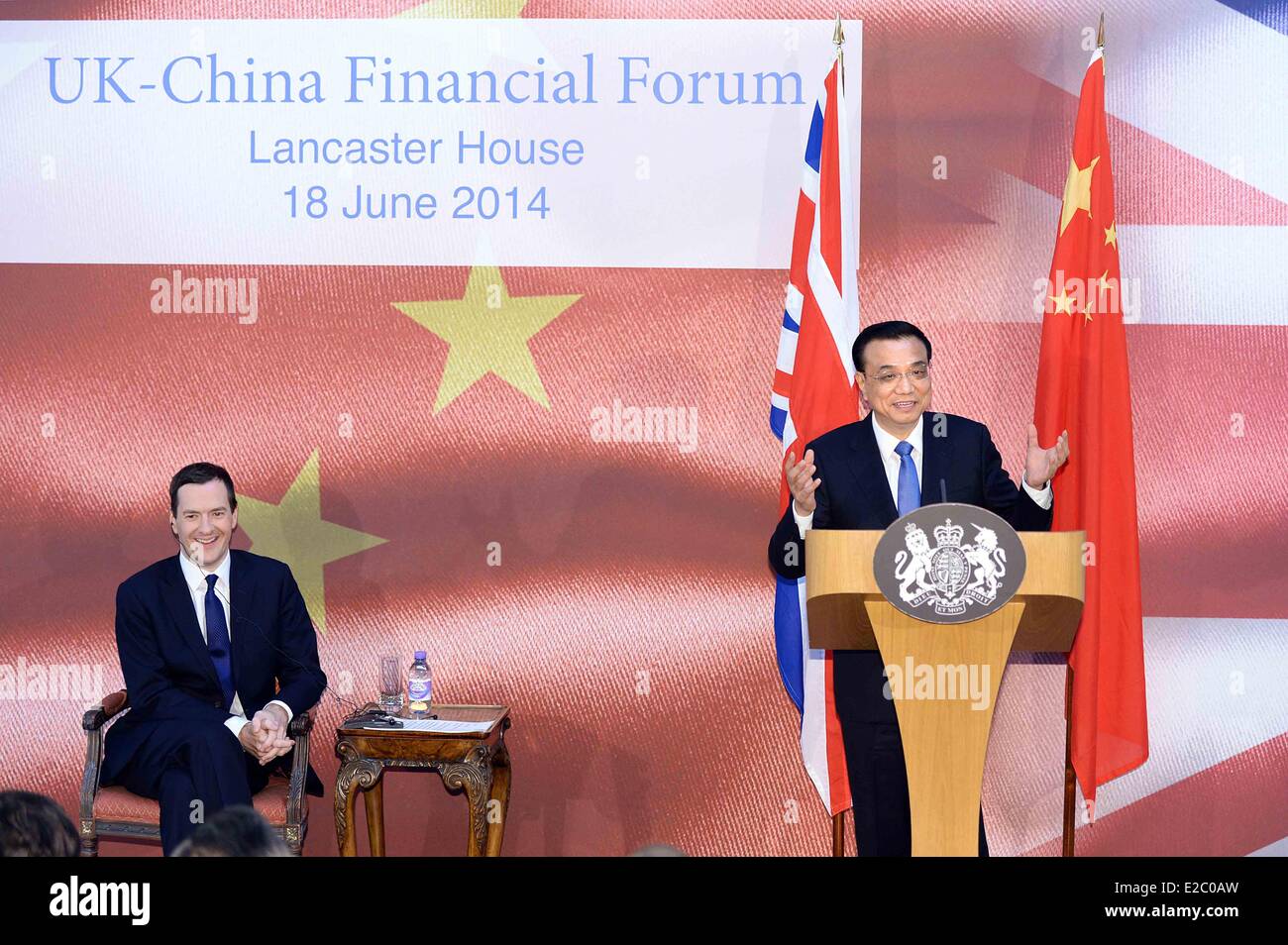 London, Britain. 18th June, 2014. Chinese Premier Li Keqiang (R) and British Chancellor of the Exchequer George Osborne attend the UK-China Financial Forum in London, capital of Britain, June 18, 2014. Credit:  Li Tao/Xinhua/Alamy Live News Stock Photo