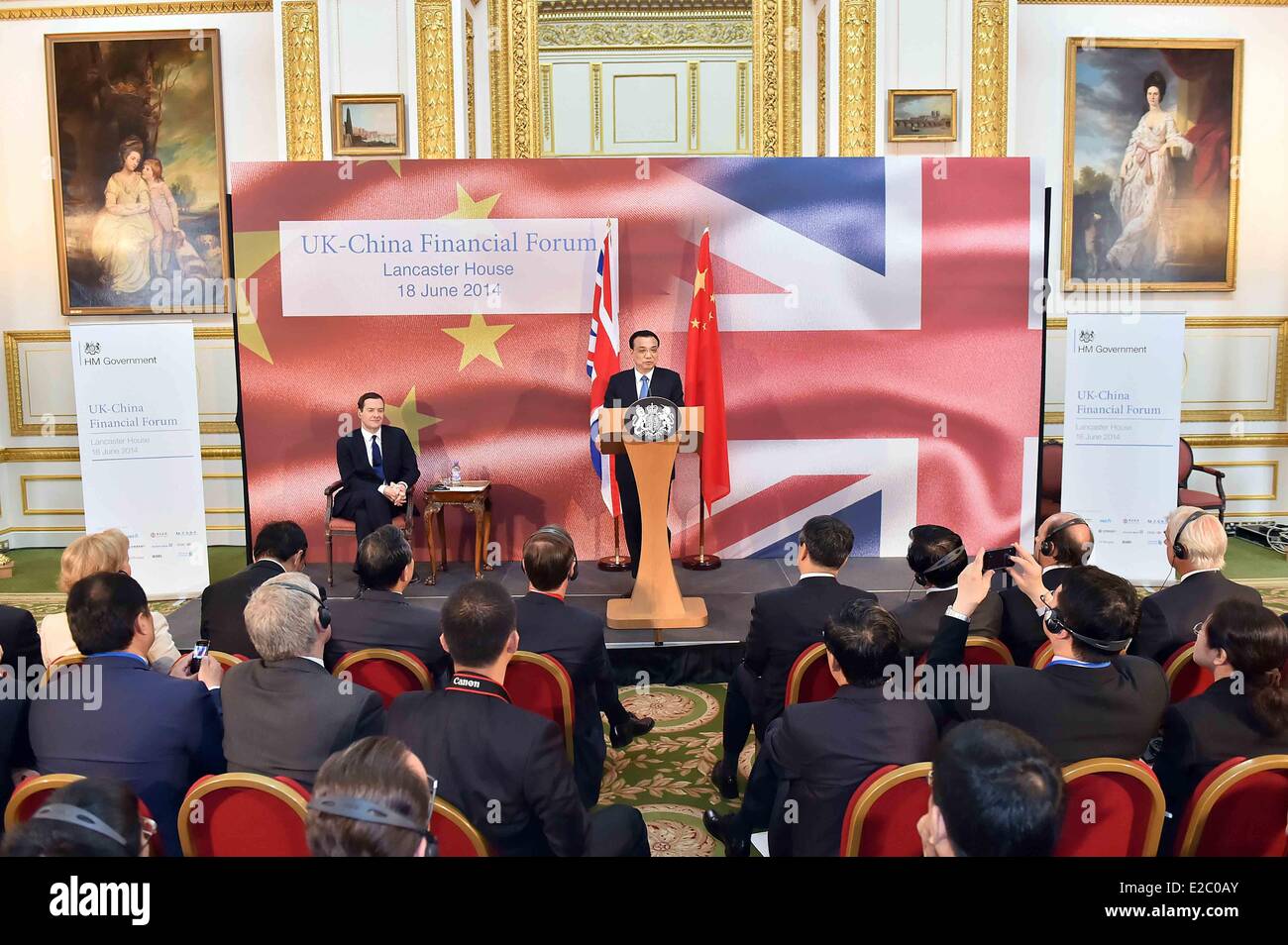 London, Britain. 18th June, 2014. Chinese Premier Li Keqiang (R, back) and British Chancellor of the Exchequer George Osborne (L, back) attend the UK-China Financial Forum in London, capital of Britain, June 18, 2014. Credit:  Li Tao/Xinhua/Alamy Live News Stock Photo