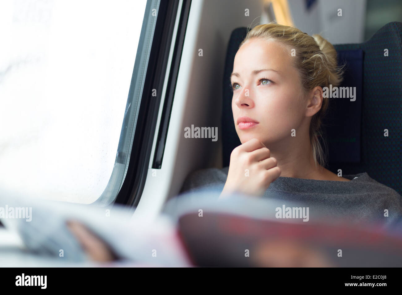 Lady traveling by train. Stock Photo