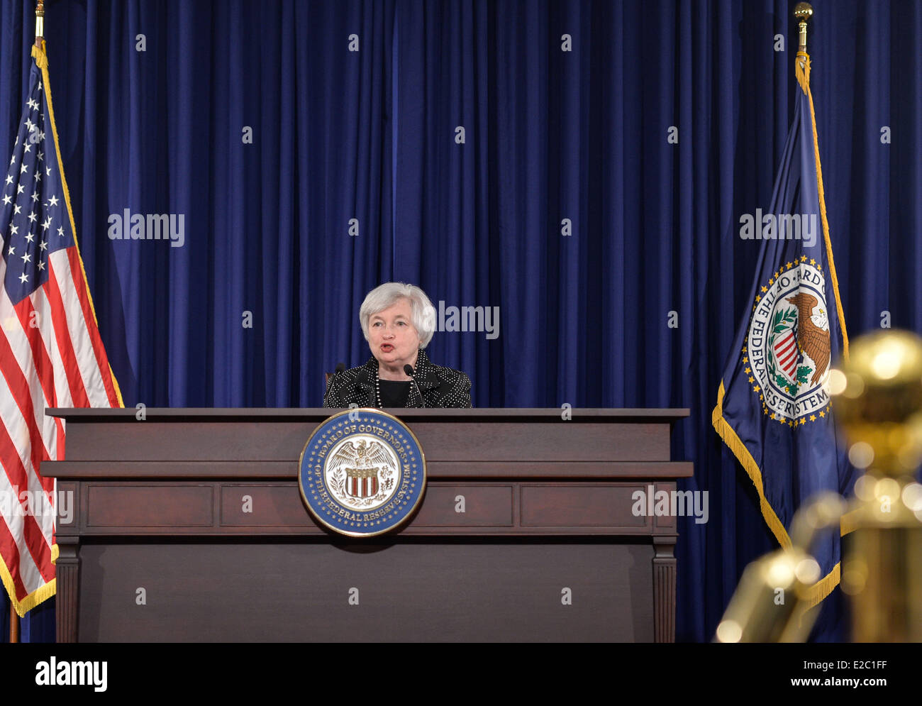 Washington, US. 18th June, 2014. US Federal Reserve Chair Janet Yellen speaks during a press conference at Federal Reserve Board building in Washington, DC, capital of the United States, June 18, 2014. The US Federal Reserve announced Wednesday that it will continue tapering its monthly bond purchase program by another 10 billion U.S. dollars next month, after lowering its growth forecast for the world's largest economy this year. Credit:  Xinhua/Alamy Live News Stock Photo