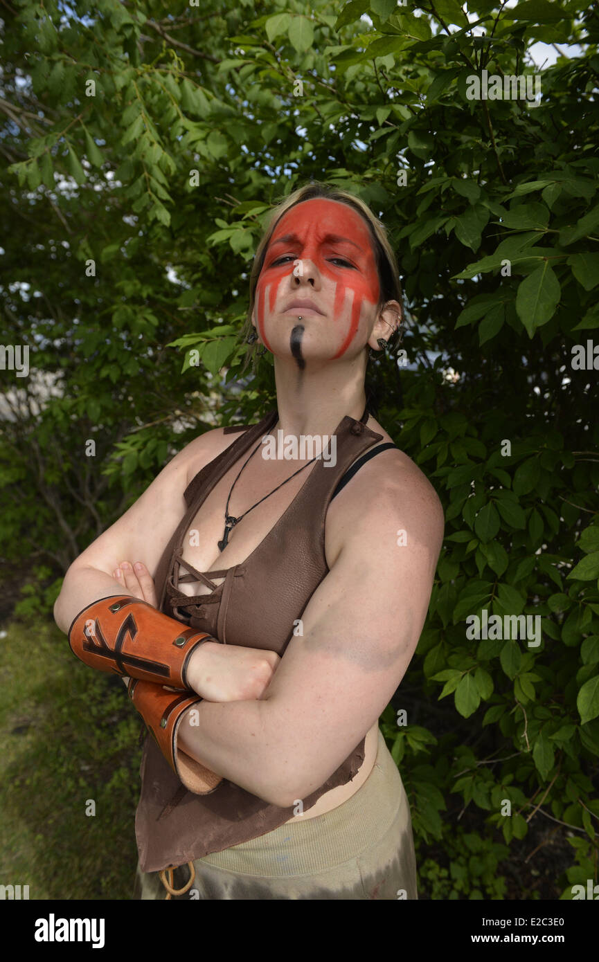 Garden City, New York, USA. 14th June, 2014. ASHLEY MORSE, of Queens, is wearing red and black face paint and a costume of Slania the Dagorhir female warrior, at Eternal Con, the Long Island Comic Con Pop Culture Expo, held at the Cradle of Aviation Museum. © Ann Parry/ZUMA Wire/ZUMAPRESS.com/Alamy Live News Stock Photo