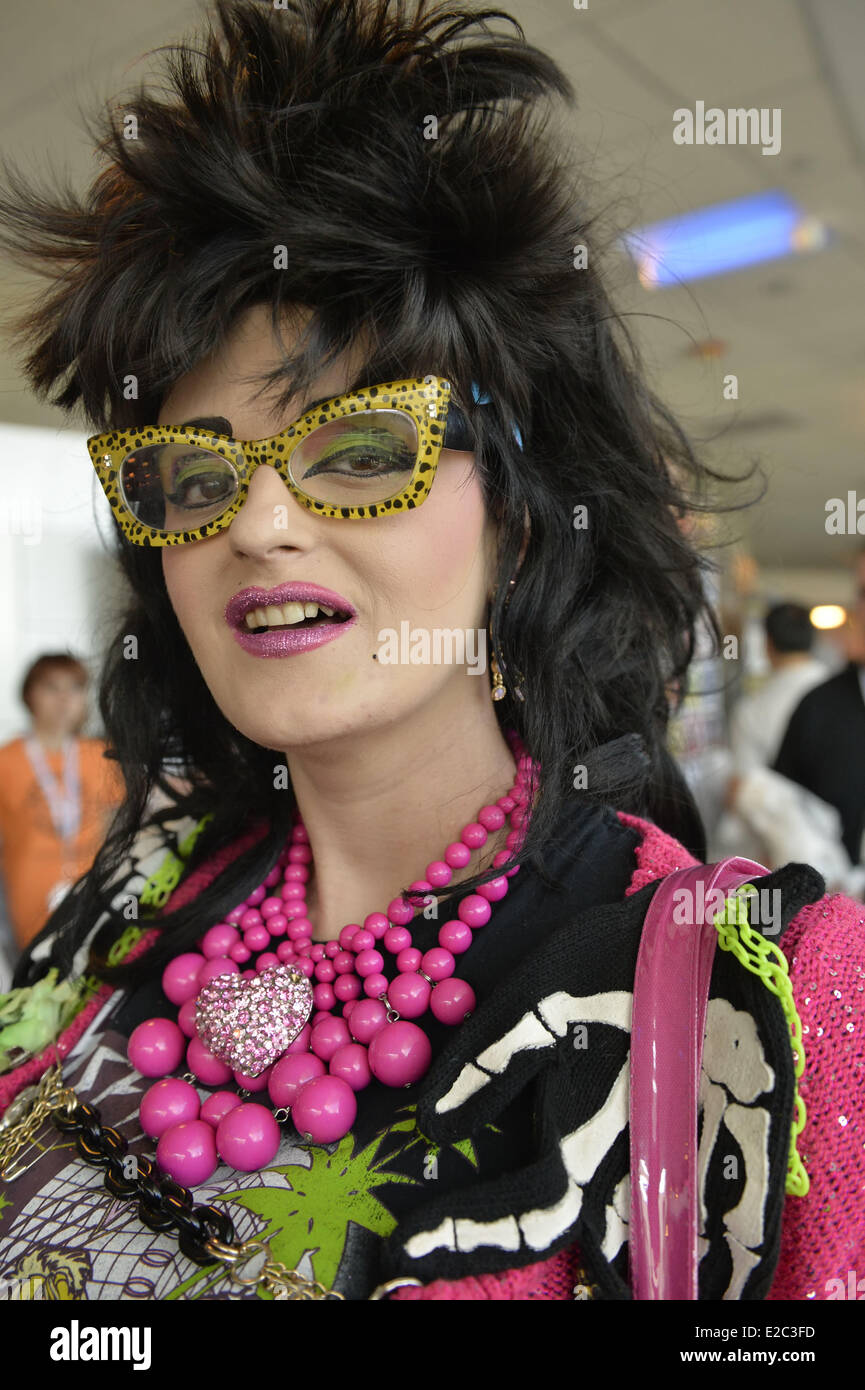Garden City, New York, USA. 14th June, 2014. LINDSAY LOWE, a cartoon couture fashionista who's a TV personality on PA LIVE in Pennsylvania, wears colorful yellow sunglasses and neon pink outfit at Eternal Con, the Long Island Comic Con Pop Culture Expo, held at the Cradle of Aviation Museum. © Ann Parry/ZUMA Wire/ZUMAPRESS.com/Alamy Live News Stock Photo