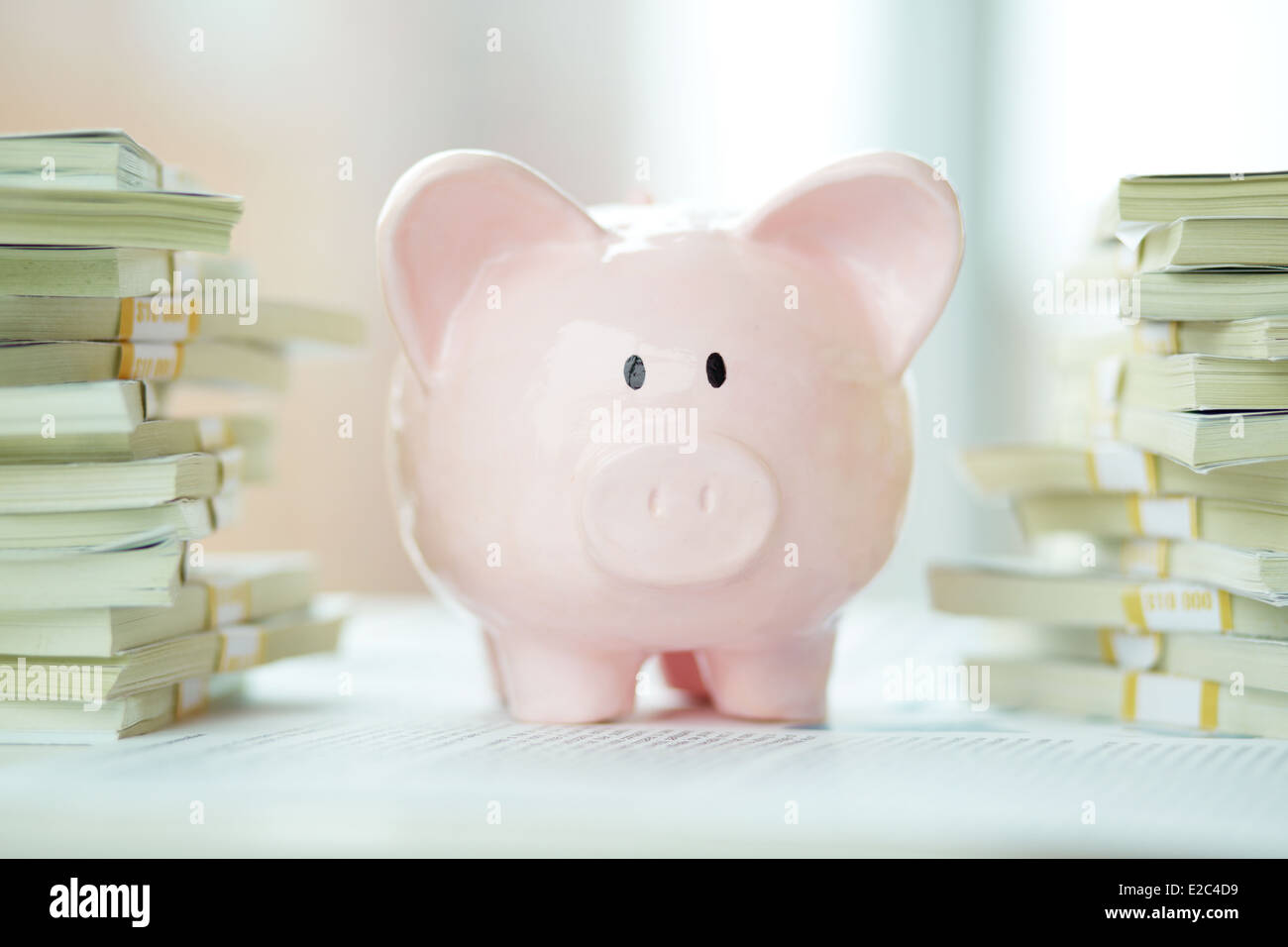 Image of pink piggy bank surrounded by stacks of dollar bills Stock ...