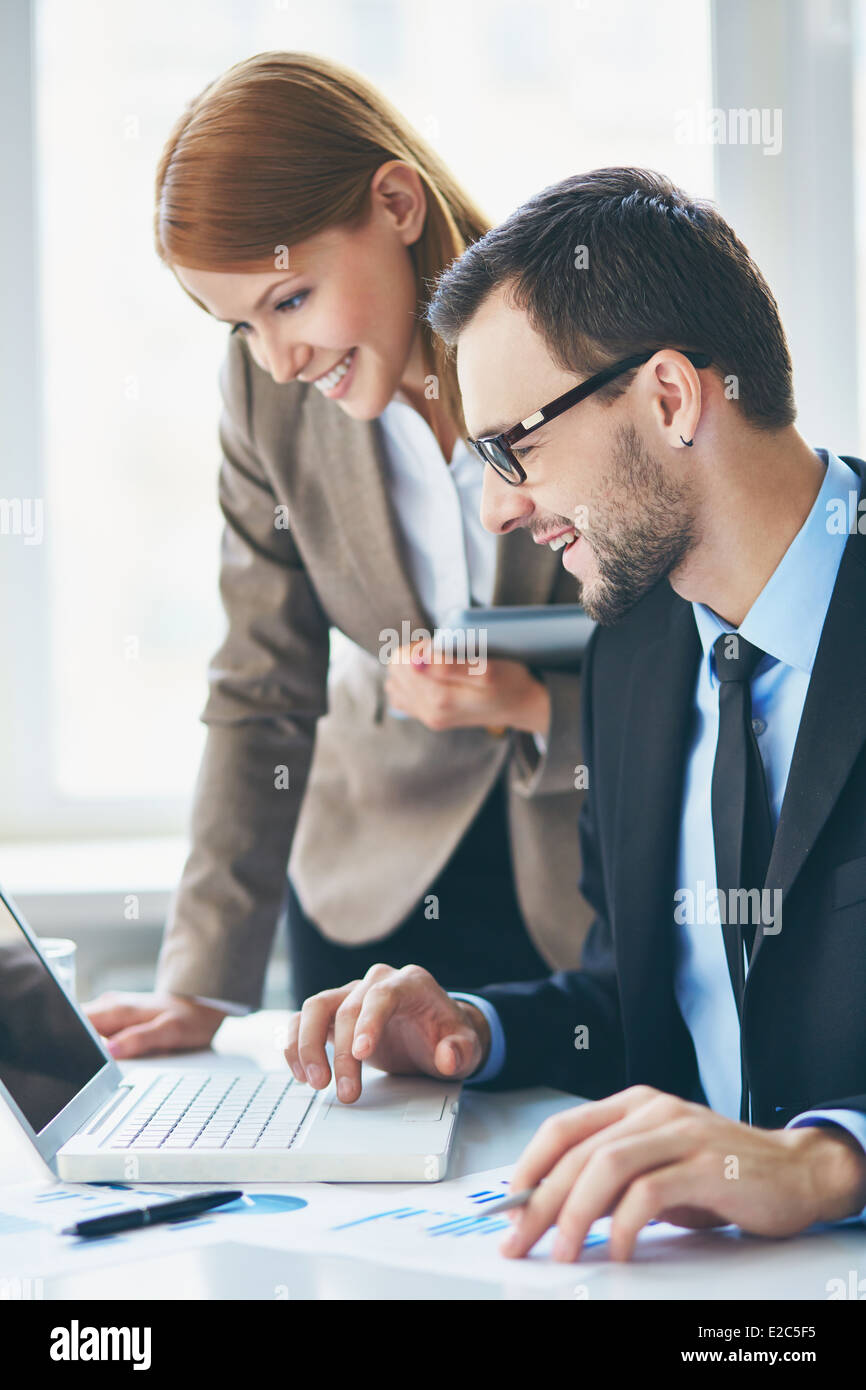Using Computer With Partner Business partners using laptop hi-res stock photography and images - Alamy