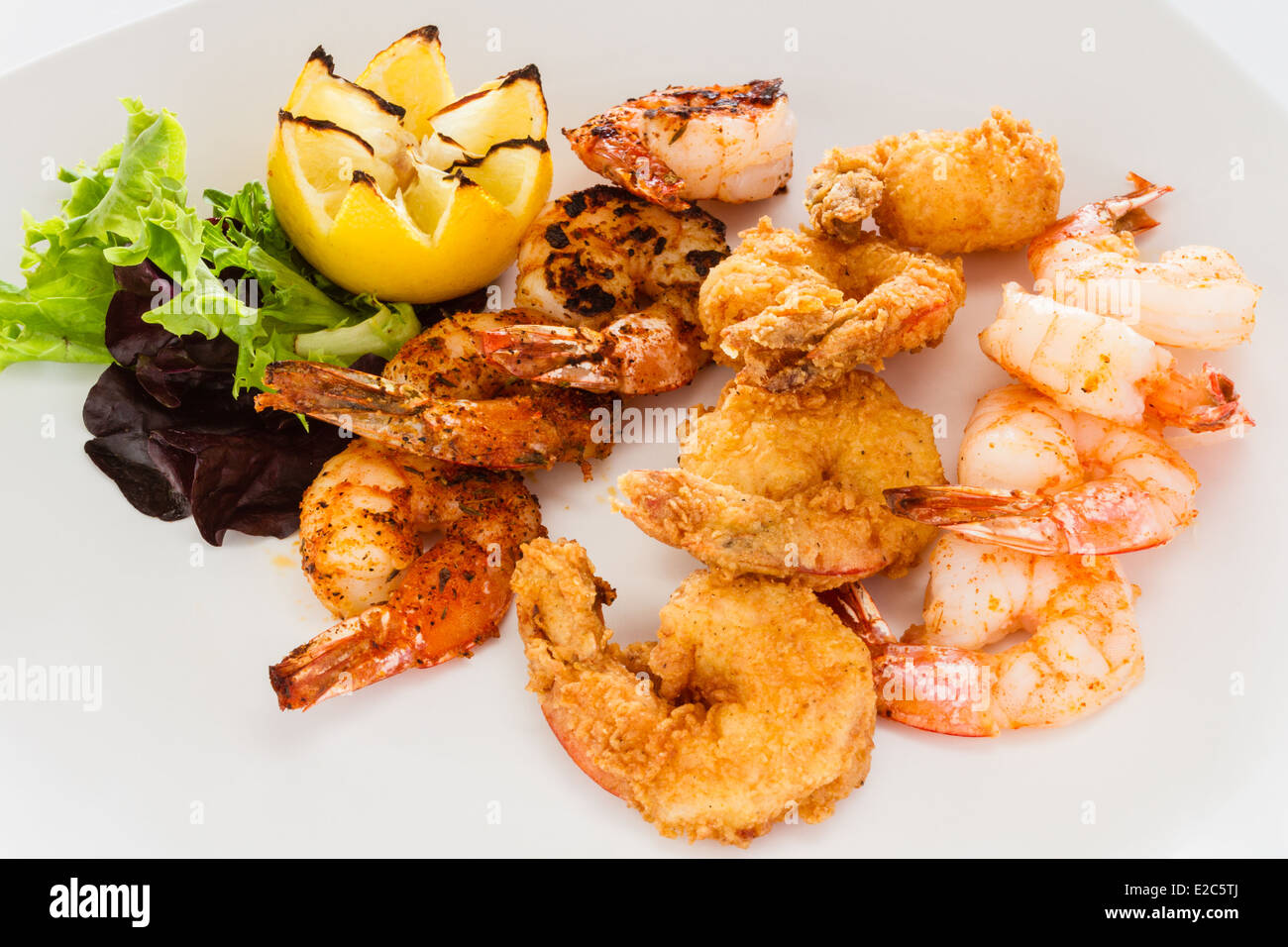 Appetizer of fried, grilled, and blackened shrimp. Stock Photo