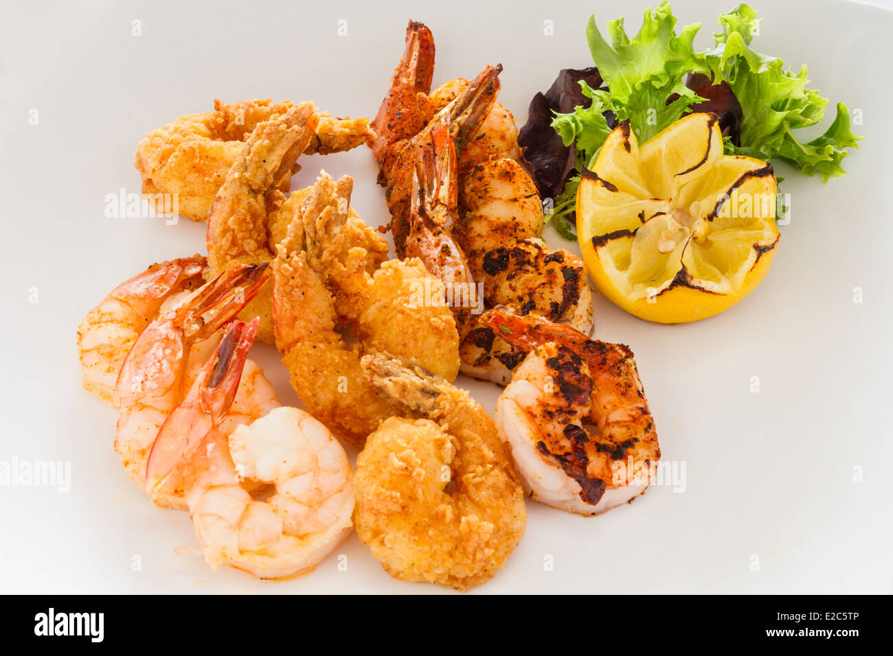Appetizer of fried, grilled, and blackened shrimp. Stock Photo