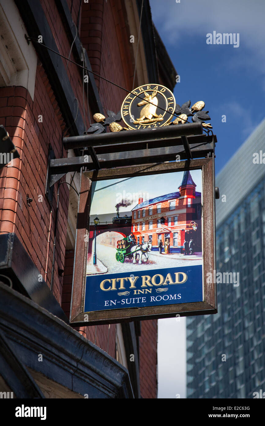 City road Inn pub, (Whitbread Plc) hanging illustration signs, on a busy corner location close to the Bridgewater Hall, Manchester, UK Stock Photo