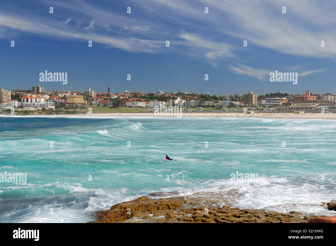 Australia, New South Wales, Sydney, Bondi Beach, surfer lying on his