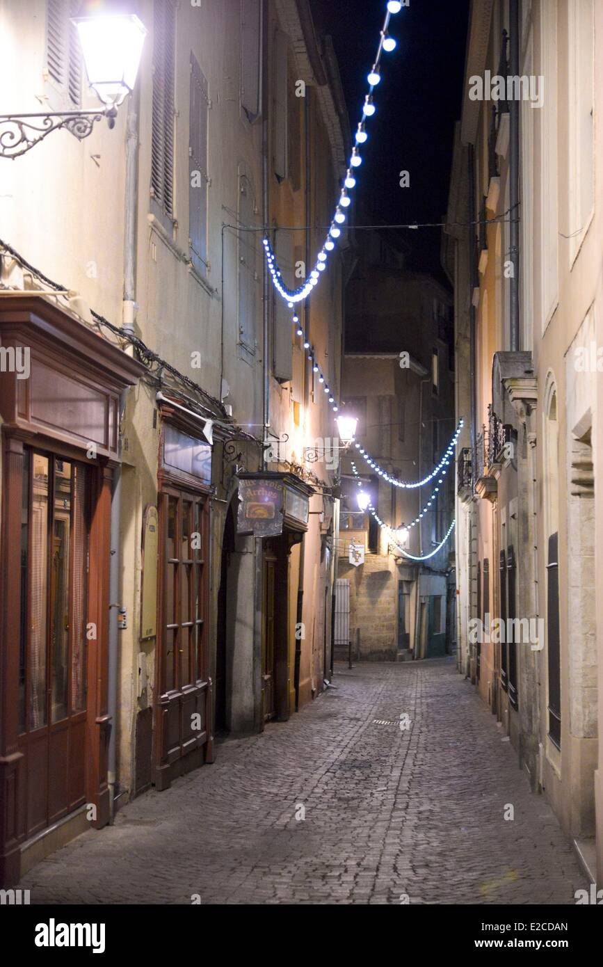 France, Herault, Beziers, Viennet Stret, pedestrian alley seen of night surrounded with shops in the wooden facades Stock Photo