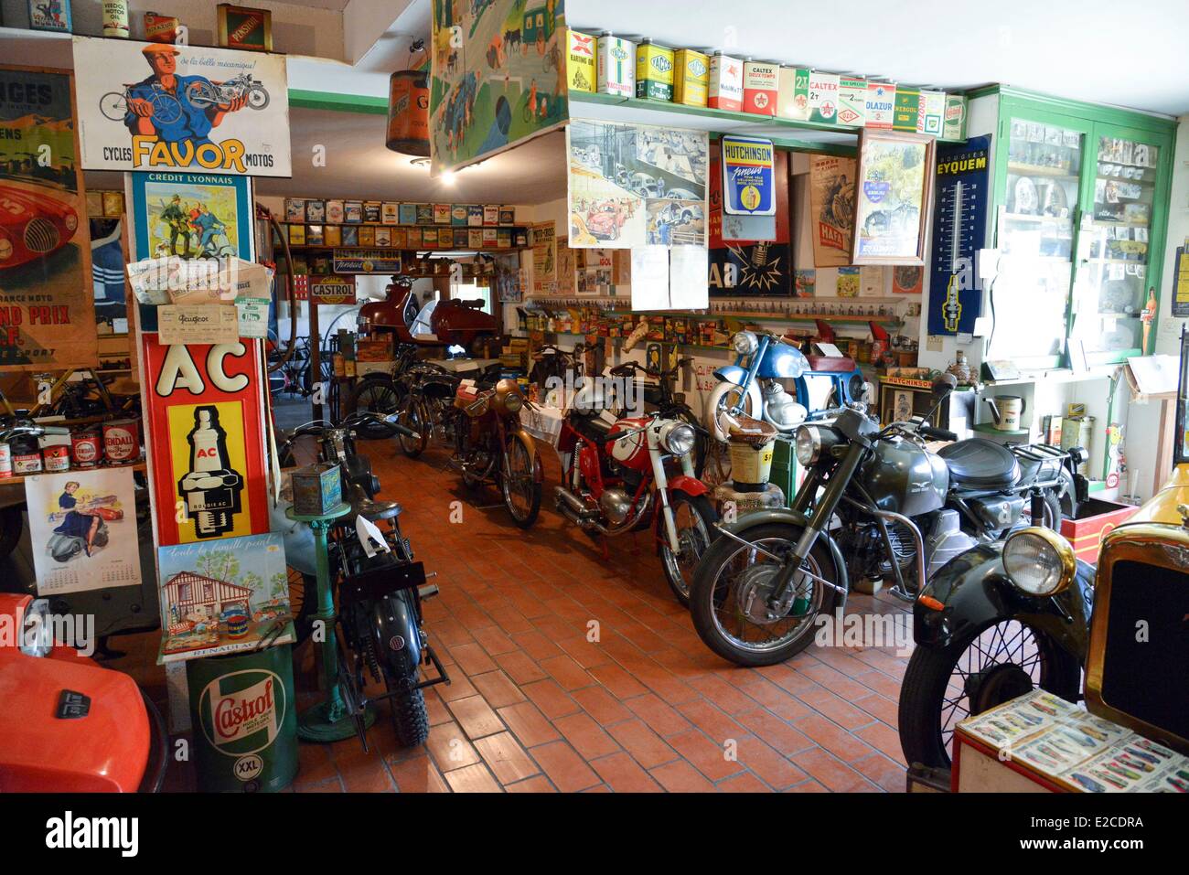 France, Herault, Boujan sur Libron, Chapy museum, exhibition of former motorcycles in the middle of posters of time Stock Photo