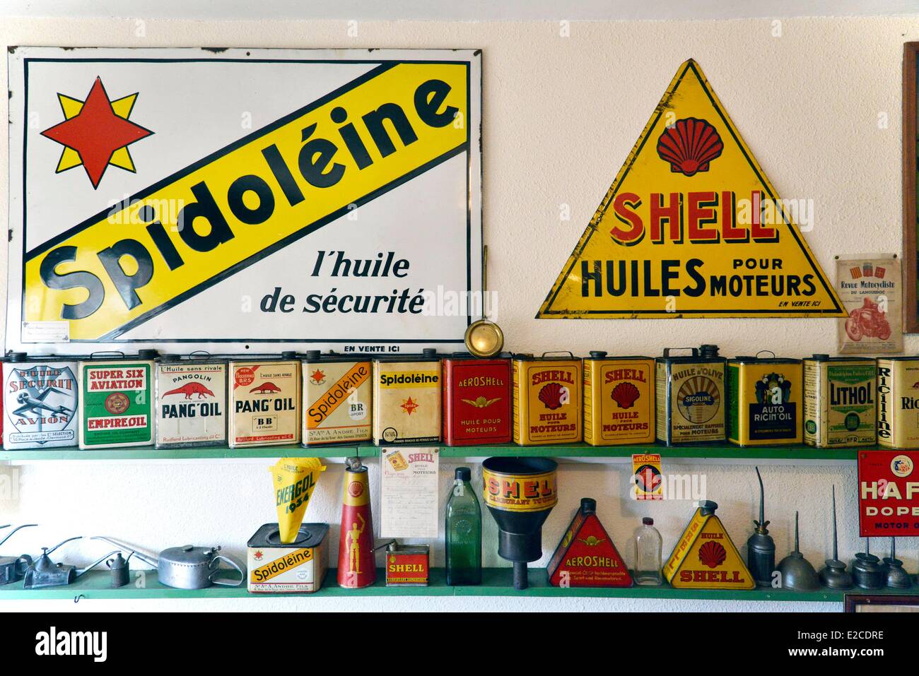 France, Herault, Boujan sur Libron, Chapy museum, collection of tins and oil cans in front of advertisements on enamel plates Stock Photo