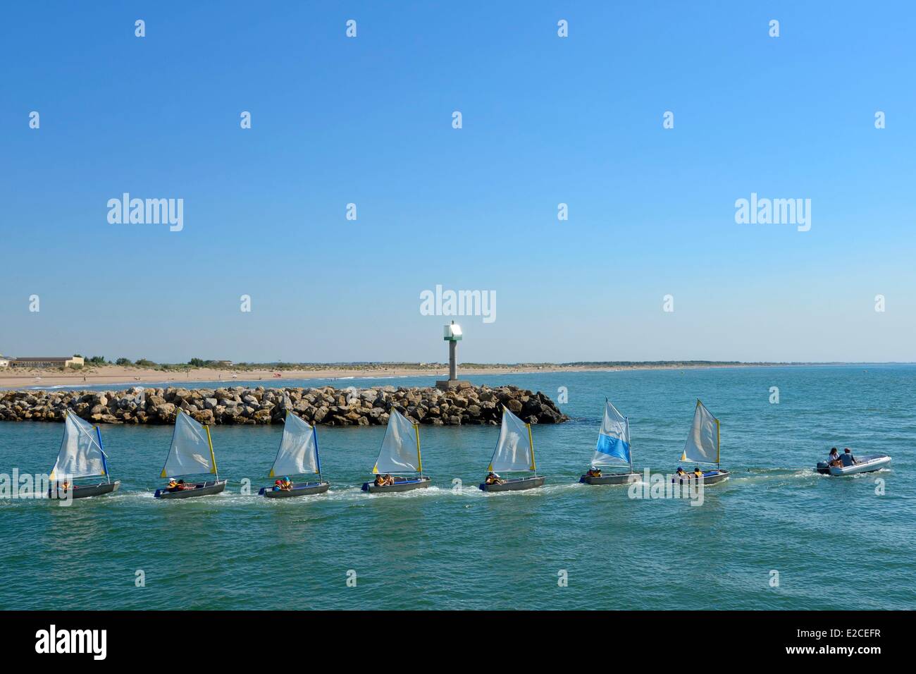 France, Herault, Valras Plage, row of small sailboats called Optimist on the river Orb which throws into the sea Stock Photo