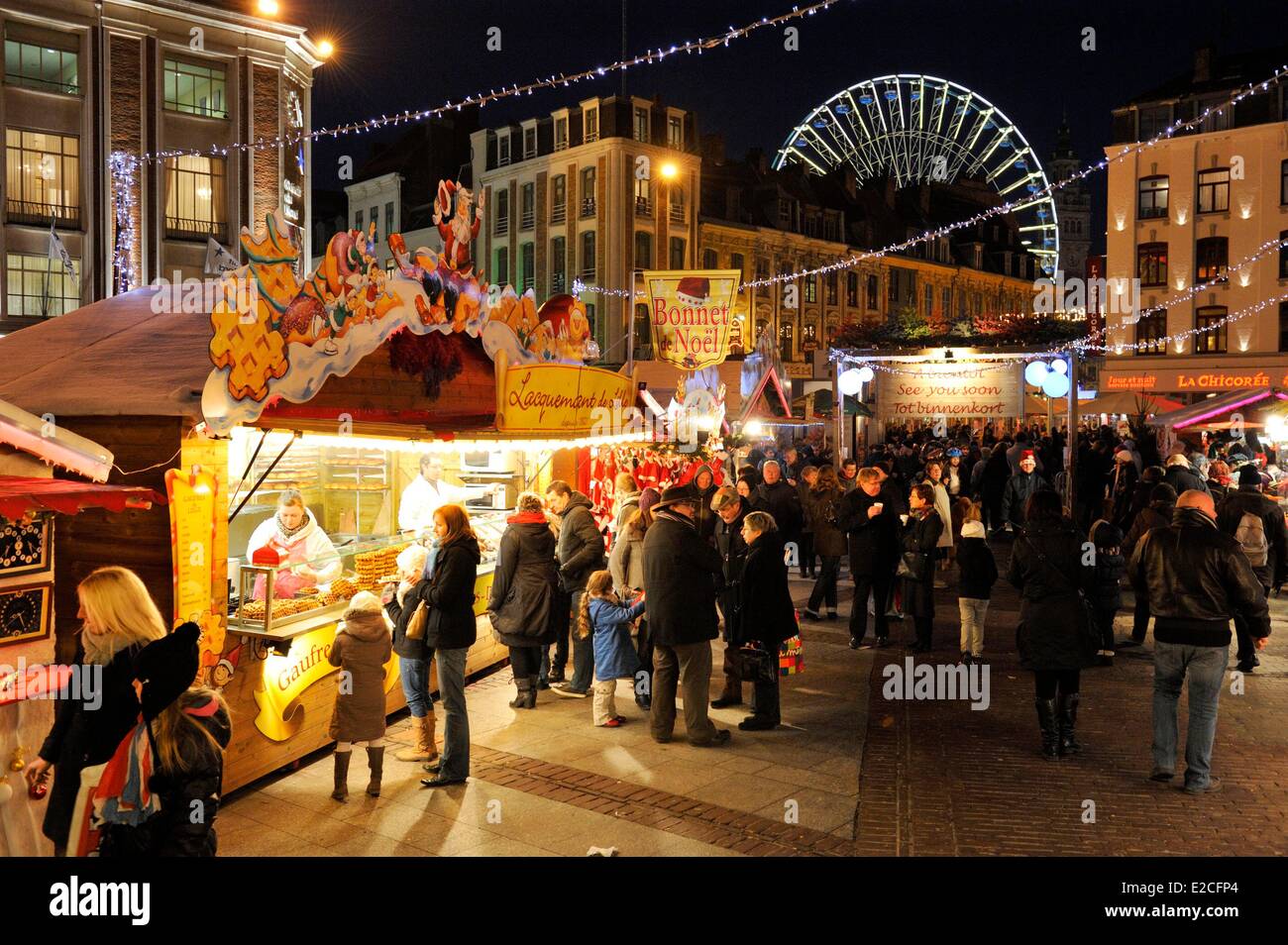 France, Nord, Lille, Place Rihour, chalet selling waffles in the Christmas market by night Stock Photo