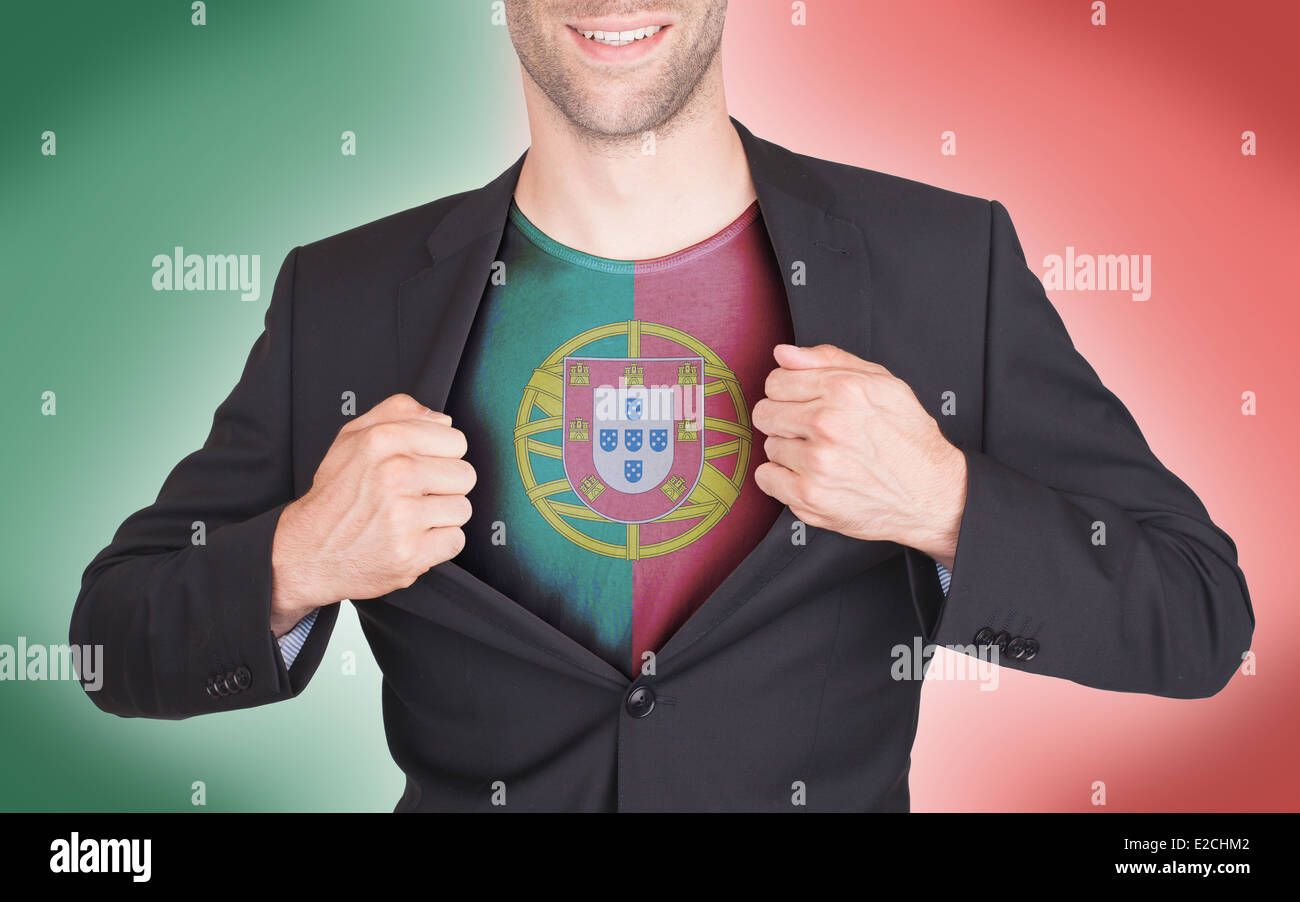 Businessman opening suit to reveal shirt with flag, Portugal Stock Photo