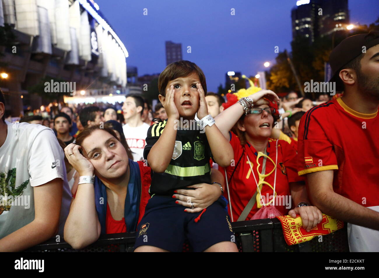 Madrid, Spain. 19th June, 2014. Spanish people reacts during the World Cup soccer match between Spain and Chile, in Madrid, Spain, Wednesday, June 18, 2014. Defending champions Spain slumped to a 2-0 defeat to Chile and crashed out of the World Cup after their second defeat in five days. Chile's victory today - through goals from Eduardo Vargas and Charles Arranguiz - made the South Americans and the Netherlands the first teams to go through to the second round. Credit:  Javier Luengo/NurPhoto/ZUMAPRESS.com/Alamy Live News Stock Photo