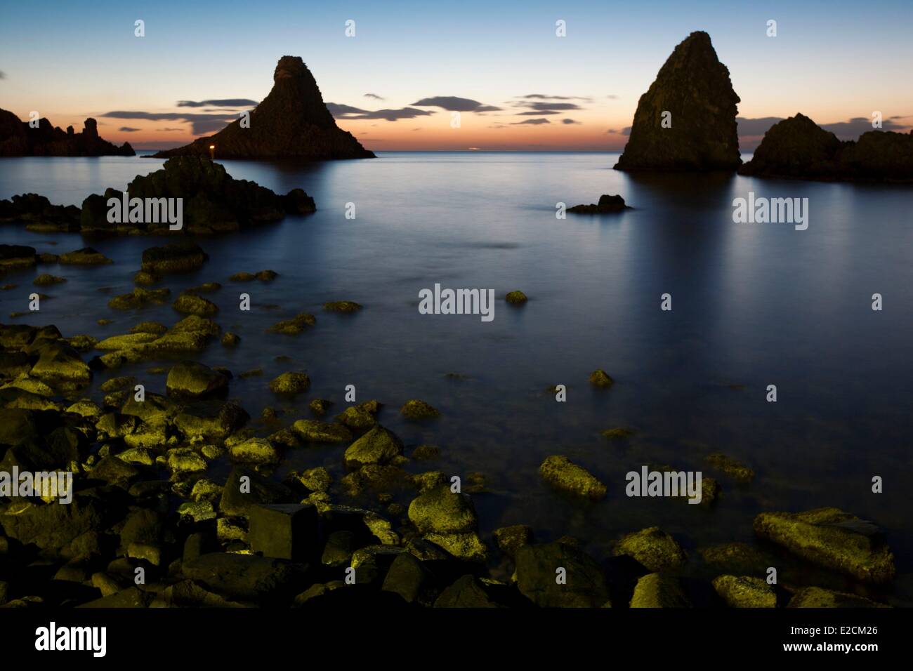 Italy Sicily Catania Province Aci Trezza Faraglioni rocks Stock Photo