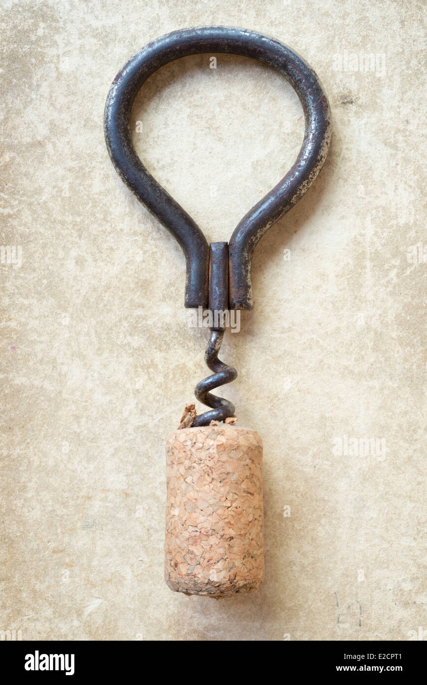 vintage corkscrew with cork on old cardboard background Stock Photo - Alamy
