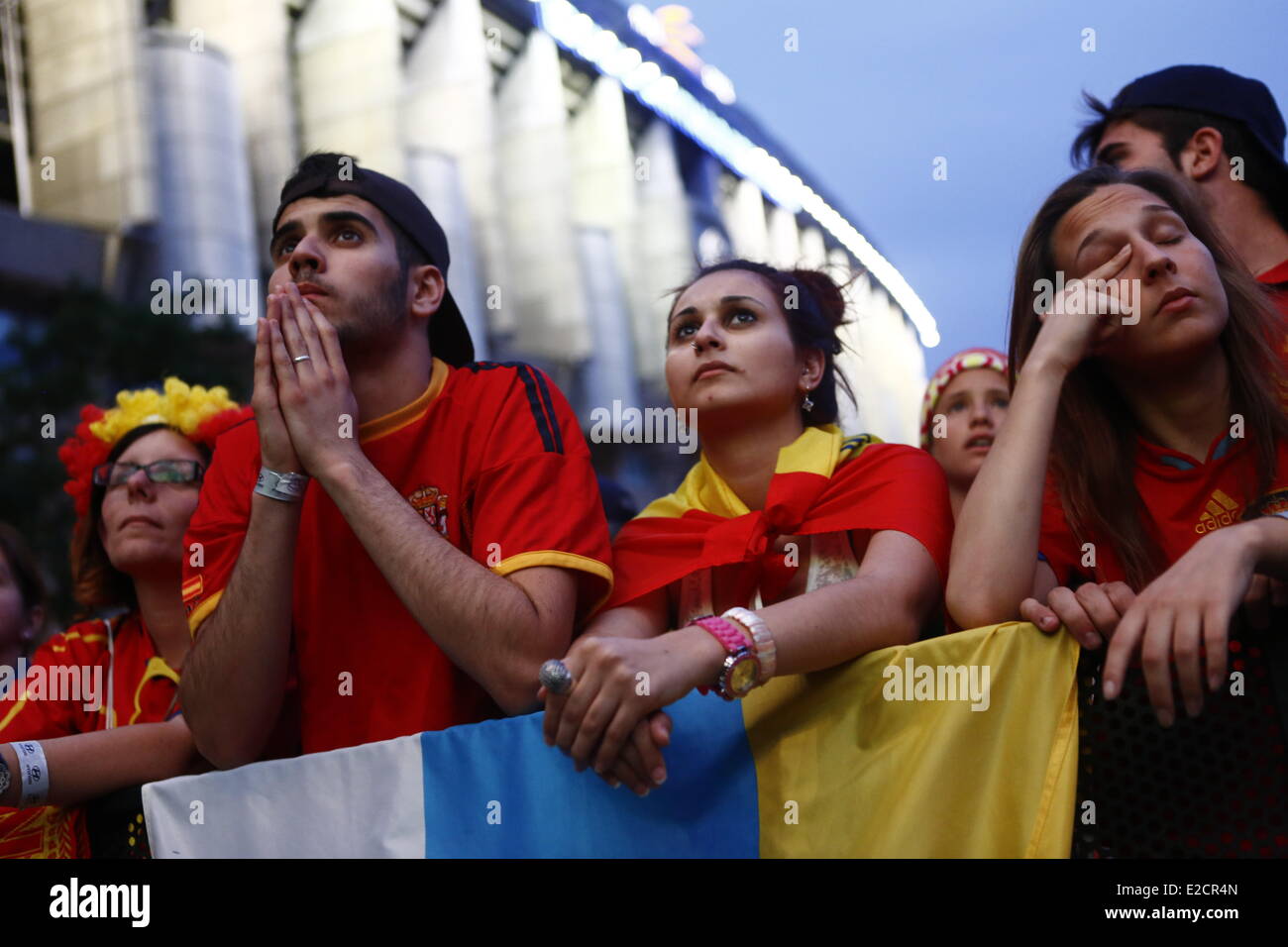 Madrid, Spain. 19th June, 2014. Spanish people reacts during the World Cup soccer match between Spain and Chile, in Madrid, Spain, Wednesday, June 18, 2014. Defending champions Spain slumped to a 2-0 defeat to Chile and crashed out of the World Cup after their second defeat in five days. Chile's victory today - through goals from Eduardo Vargas and Charles Arranguiz - made the South Americans and the Netherlands the first teams to go through to the second round. Credit:  Javier Luengo/NurPhoto/ZUMAPRESS.com/Alamy Live News Stock Photo