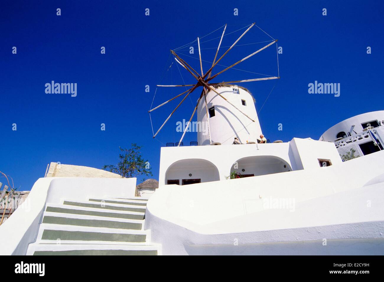 Greece Cyclades Aegean Sea Santorini Ia white windmill silhouetted against the blue sky Stock Photo