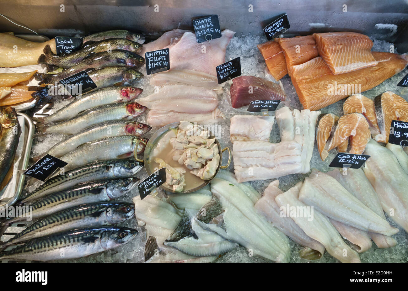 Fresh fish for sale in a local fishmonger's shop, Wales, UK - trout, herring, mackerel, whiting, salmon, hake and cod and others Stock Photo