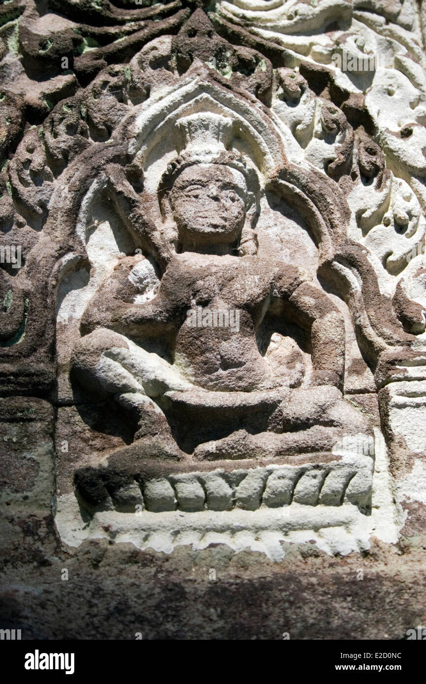 A sandstone wall relief sculpture is on display at the ruins of ancient Wat Phu in Champasak, Laos. Stock Photo