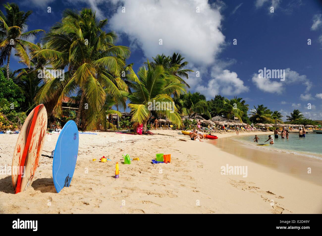 France Guadeloupe Saint Martin Cul de Sac Pinel Island two surfboards planted in the sand next to children's toys Stock Photo