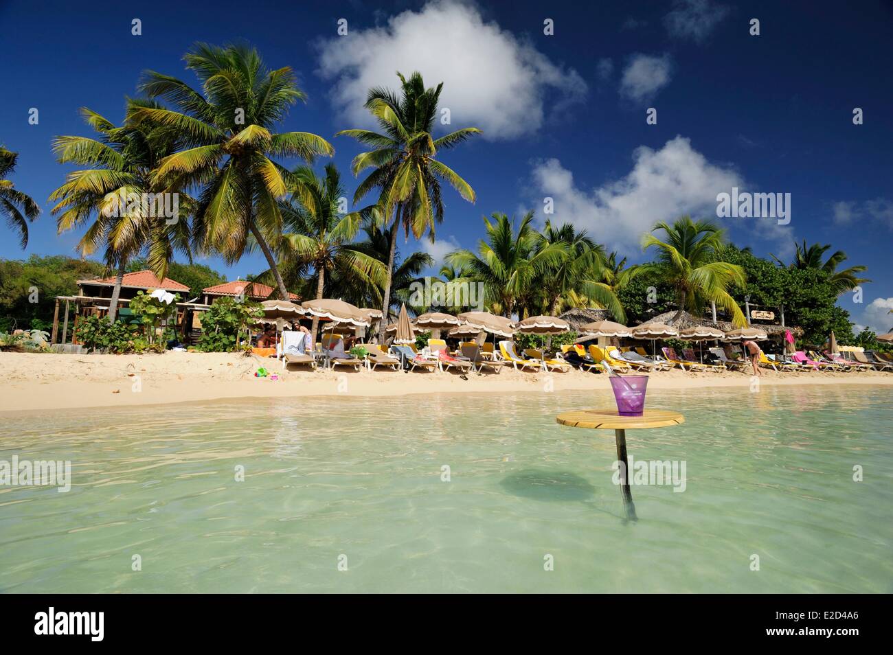 France Guadeloupe Saint Martin Cul de Sac Pinel Island table in the water on which is placed a champagne bucket Stock Photo