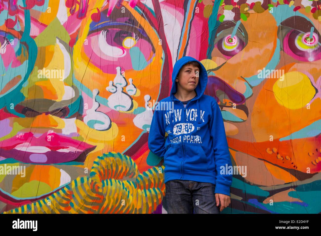 France Paris Guilhem in front of a short lived graffiti on banks of the Seine on a space planned for that purpose Stock Photo
