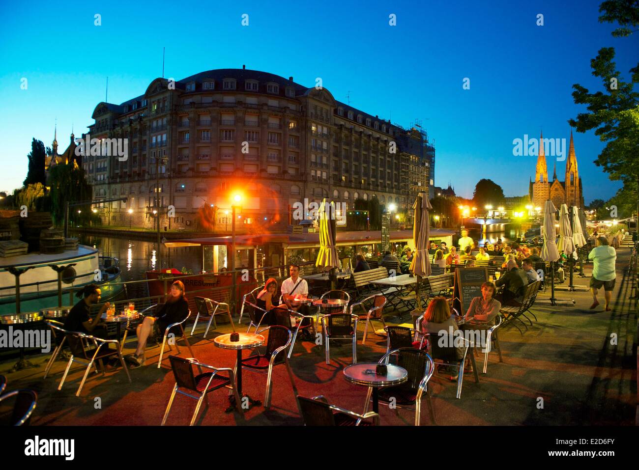 France Bas-Rhin Strasbourg old town listed as World Heritage by UNESCO cafes boats on the Quai des Bateliers on the banks of Stock Photo