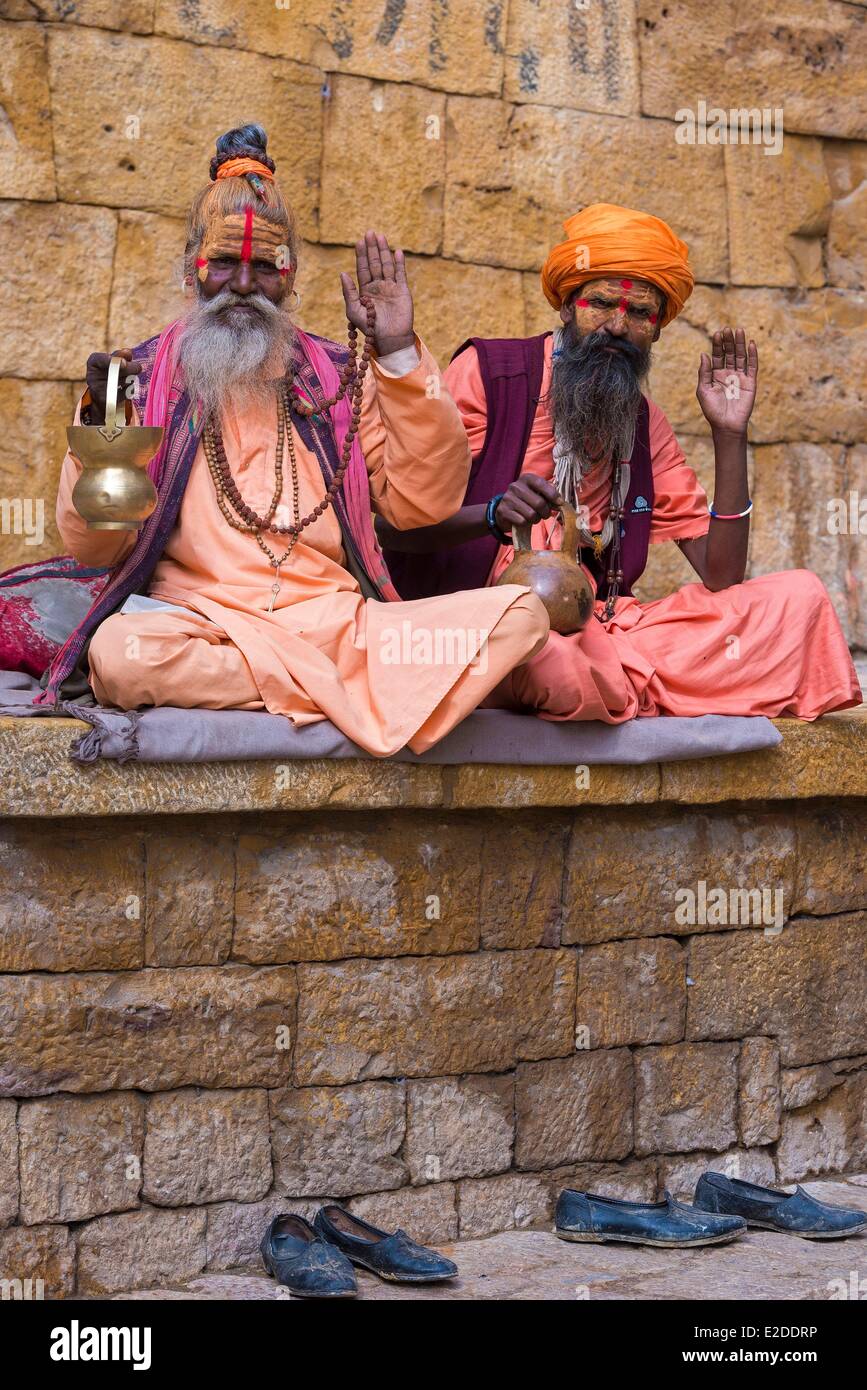 India Rajasthan state hill fort of Rajasthan listed as World Heritage by UNESCO Jaisalmer Sadhus holy men in front of the Fort Stock Photo