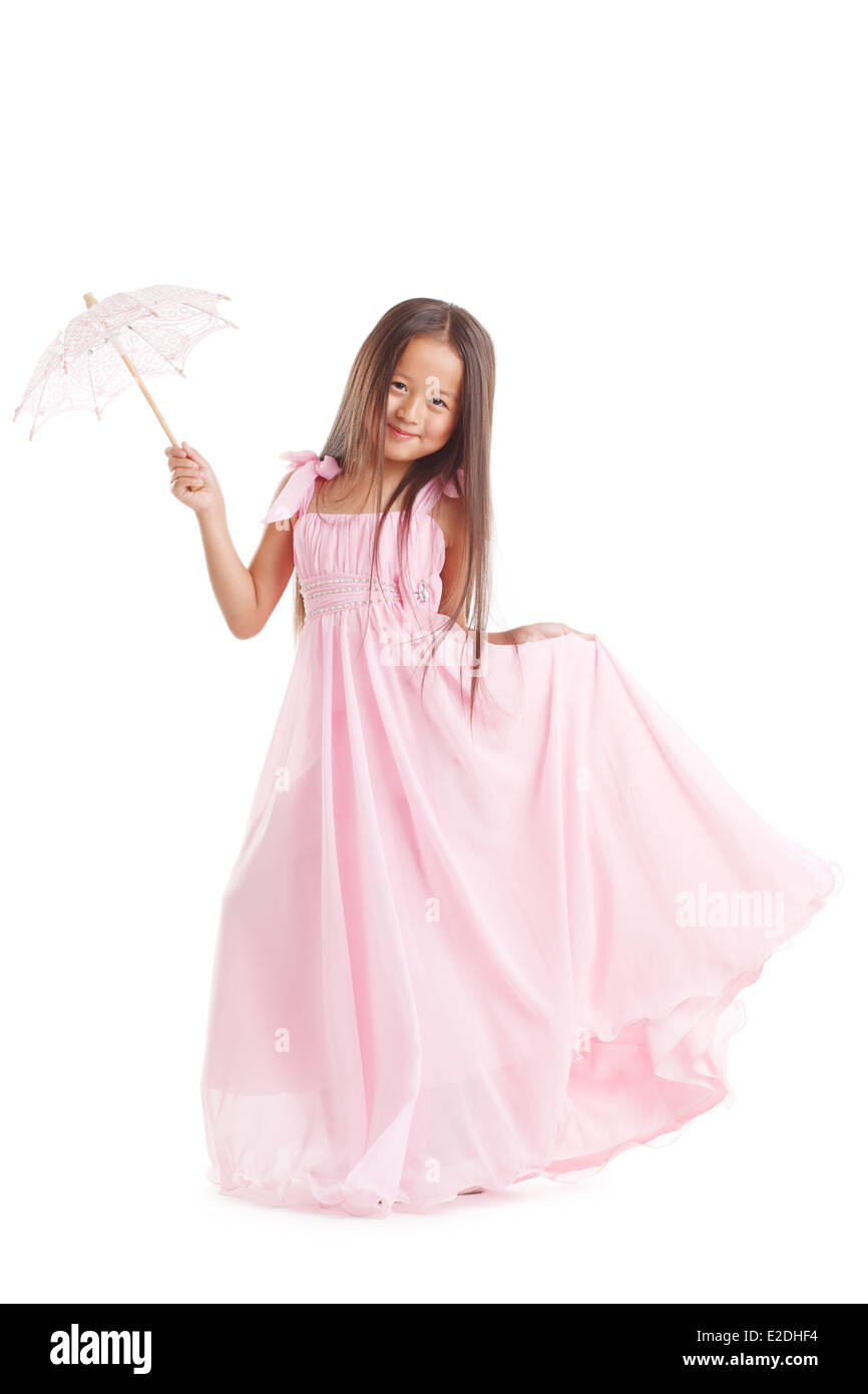Smiling girl posing in long dress with umbrella Stock Photo - Alamy