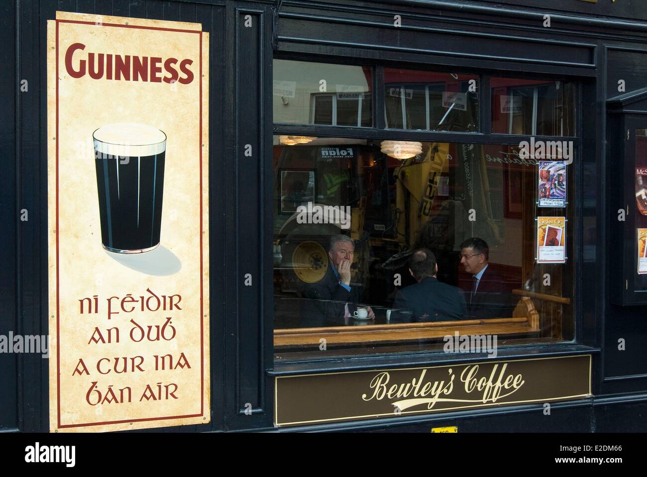Ireland Galway County Galway facade of a pub men in suits inside