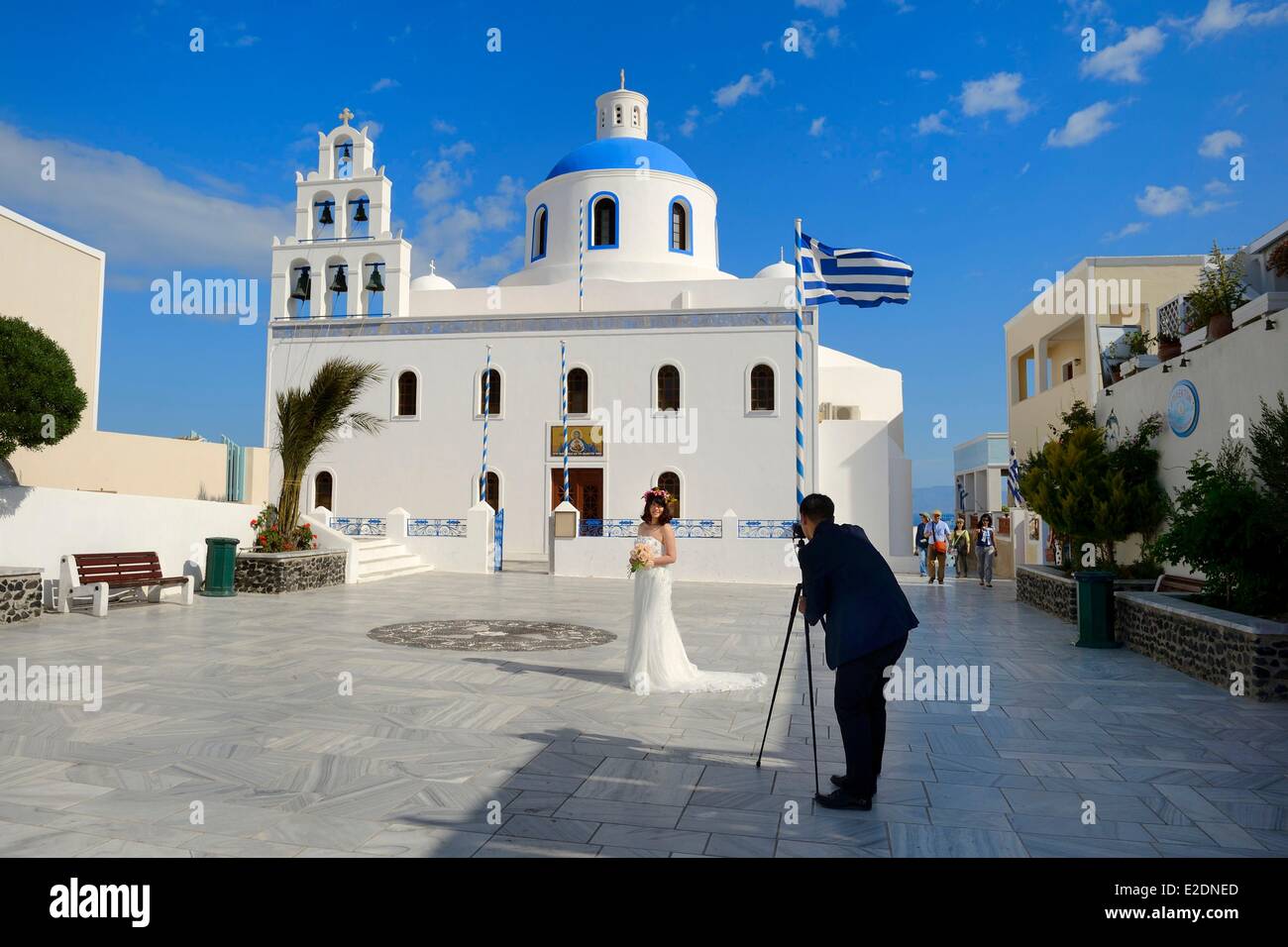 Greece Cyclades Aegean Sea Santorini (Thira or Thera) village of Oia wedding picture in front of Panagia church many Asian Stock Photo