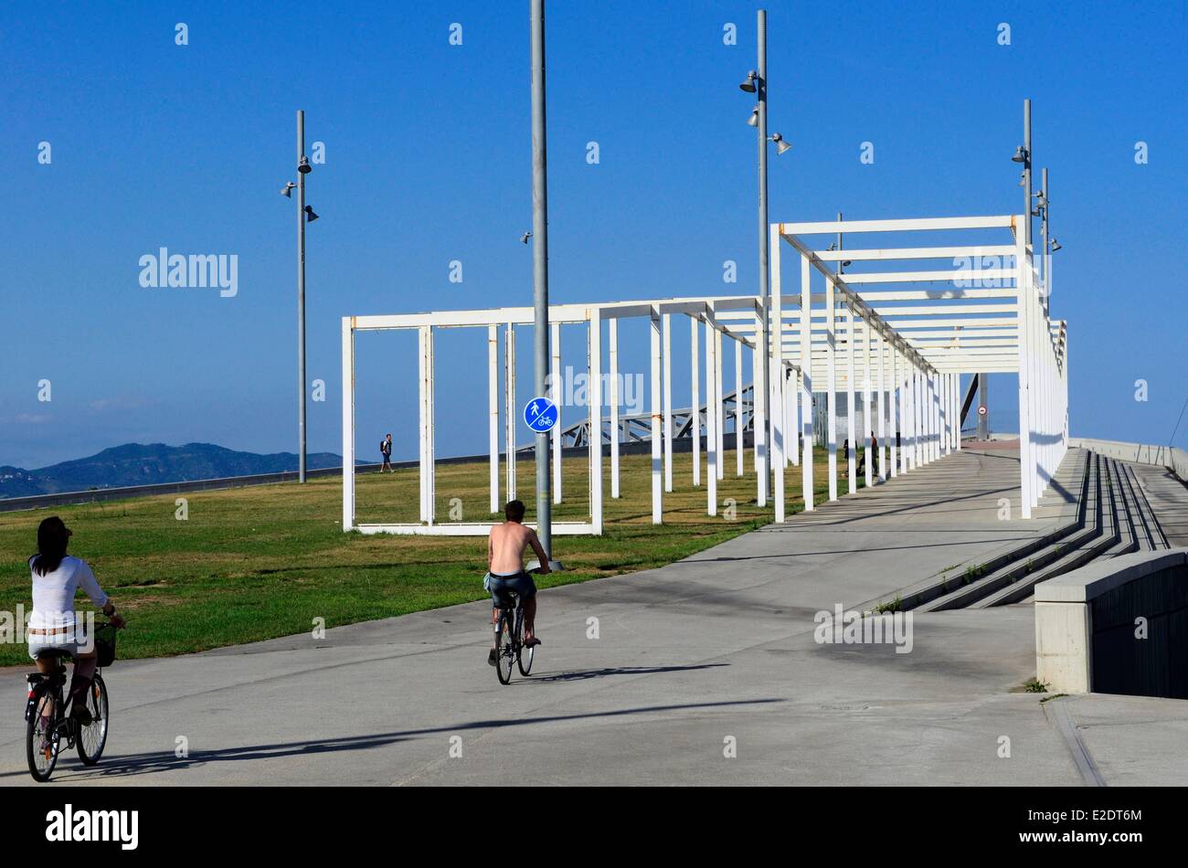 Spain Catalonia Barcelona the Forum park cyclists near the pergola fotovoltaica giant solar panel designed by the architects Stock Photo