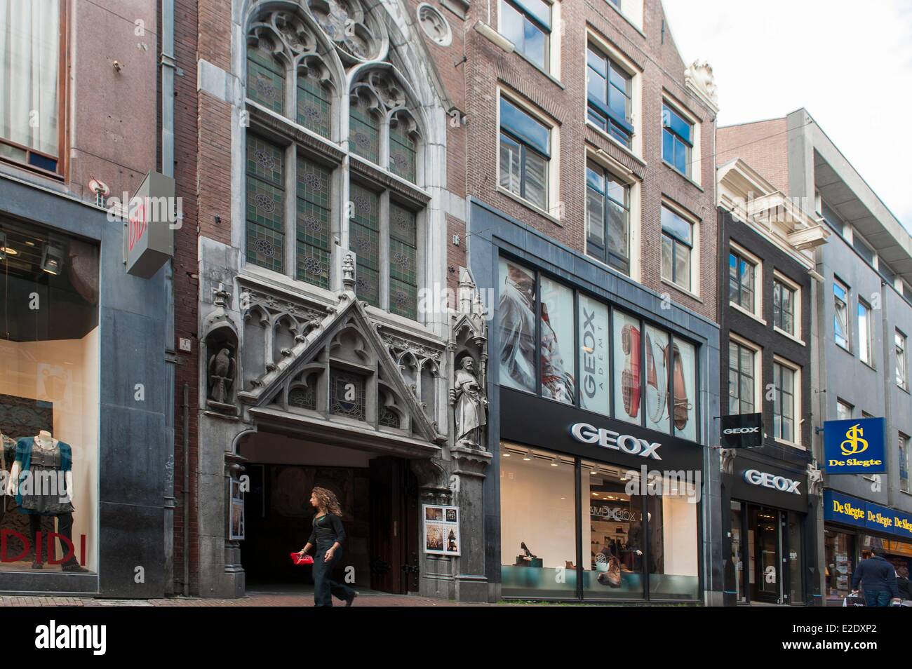 Netherlands Amsterdam church in the middle of a shopping street in the city  center Stock Photo - Alamy