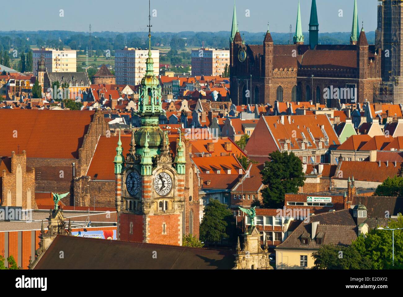 Poland Eastern Pomerania Gdansk clock tower of the railways station and in the background St. Mary's Basilica (Bazylika Stock Photo