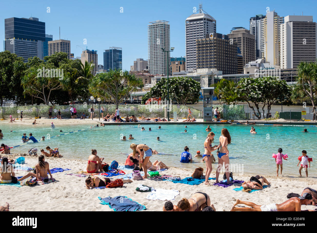 Brisbane Australia,Southbank Parklands,Streets Beach,sunbathers,sand,water CBD,city skyline,skyscrapers,buildings,AU140315046 Stock Photo