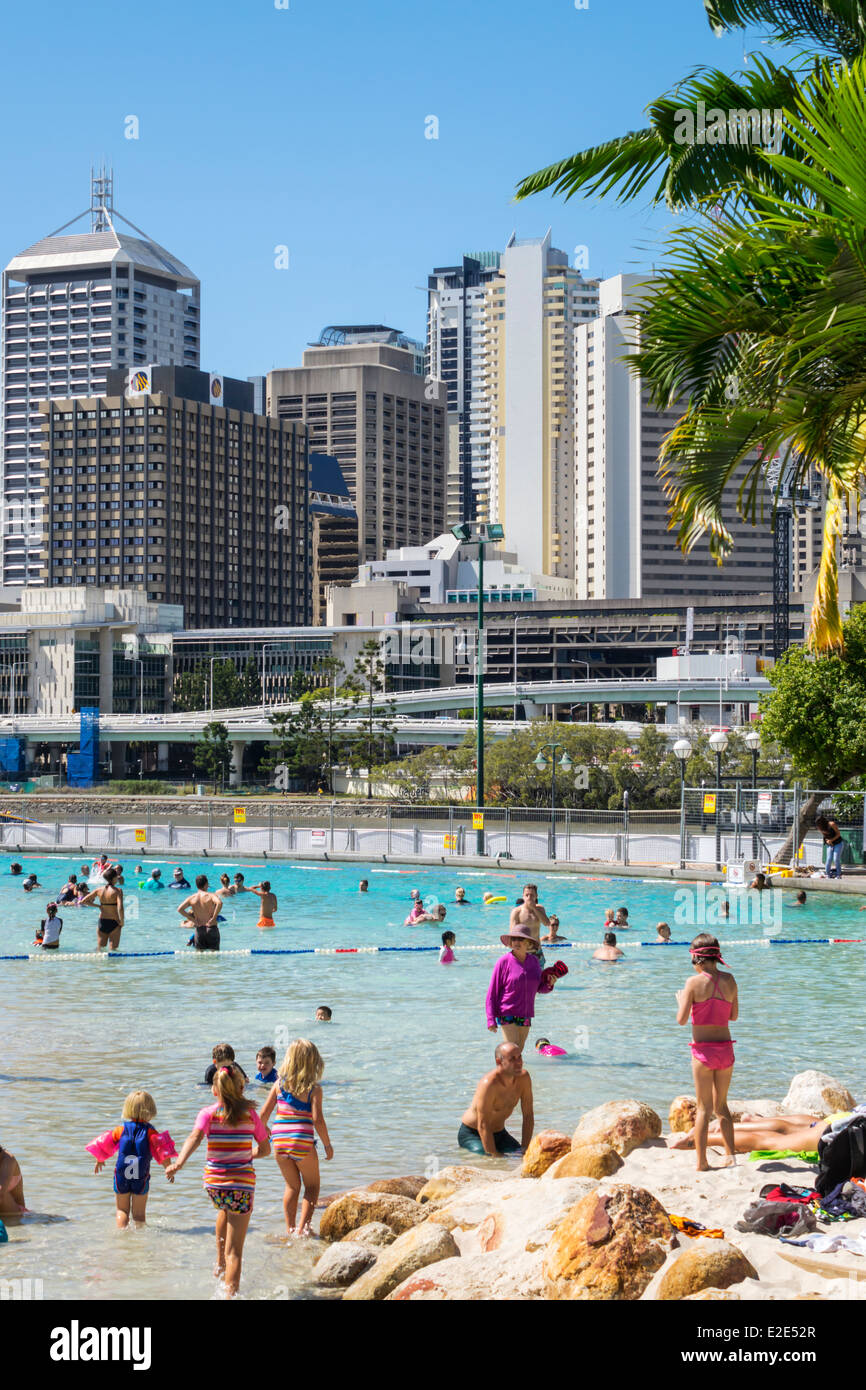 Brisbane Australia,Southbank Parklands,Streets Beach,sunbathers,sand,water CBD,city skyline,skyscrapers,buildings,AU140315053 Stock Photo