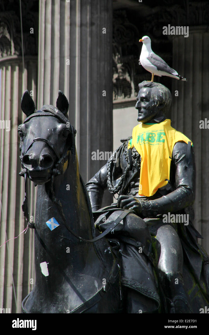 Glasgow, Scotland, UK. 19th June, 2014. The iconic Duke of Wellington statue swaps his traditional traffic cone hat for a cheeky 'Anyone But England' supporters football shirt during the world cup Credit:  ALAN OLIVER/Alamy Live News Stock Photo