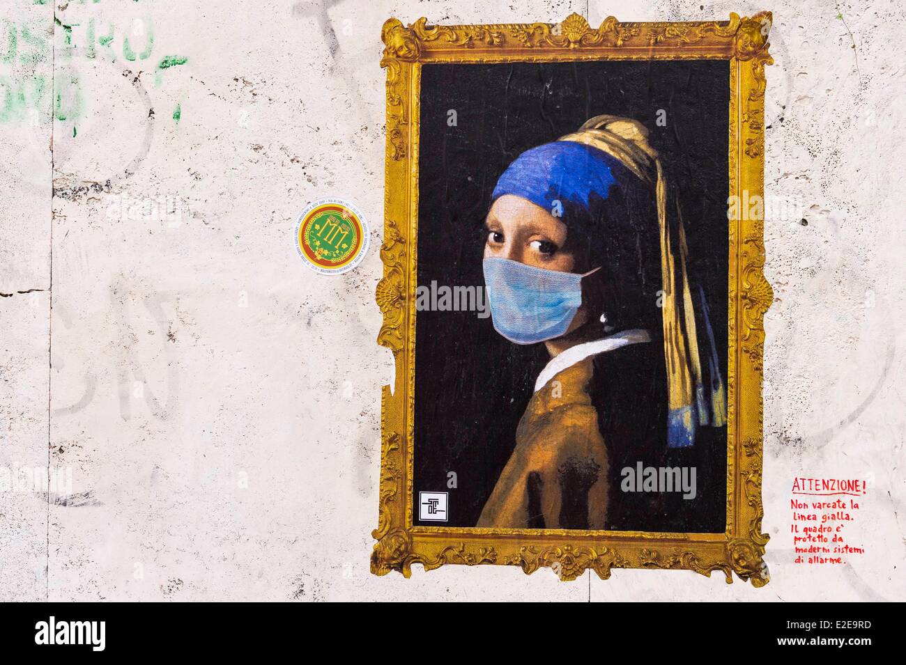 Italy, Lazio, Rome, diverted painting of Girl with a Pearl Earring by Vermeer on a wall Stock Photo