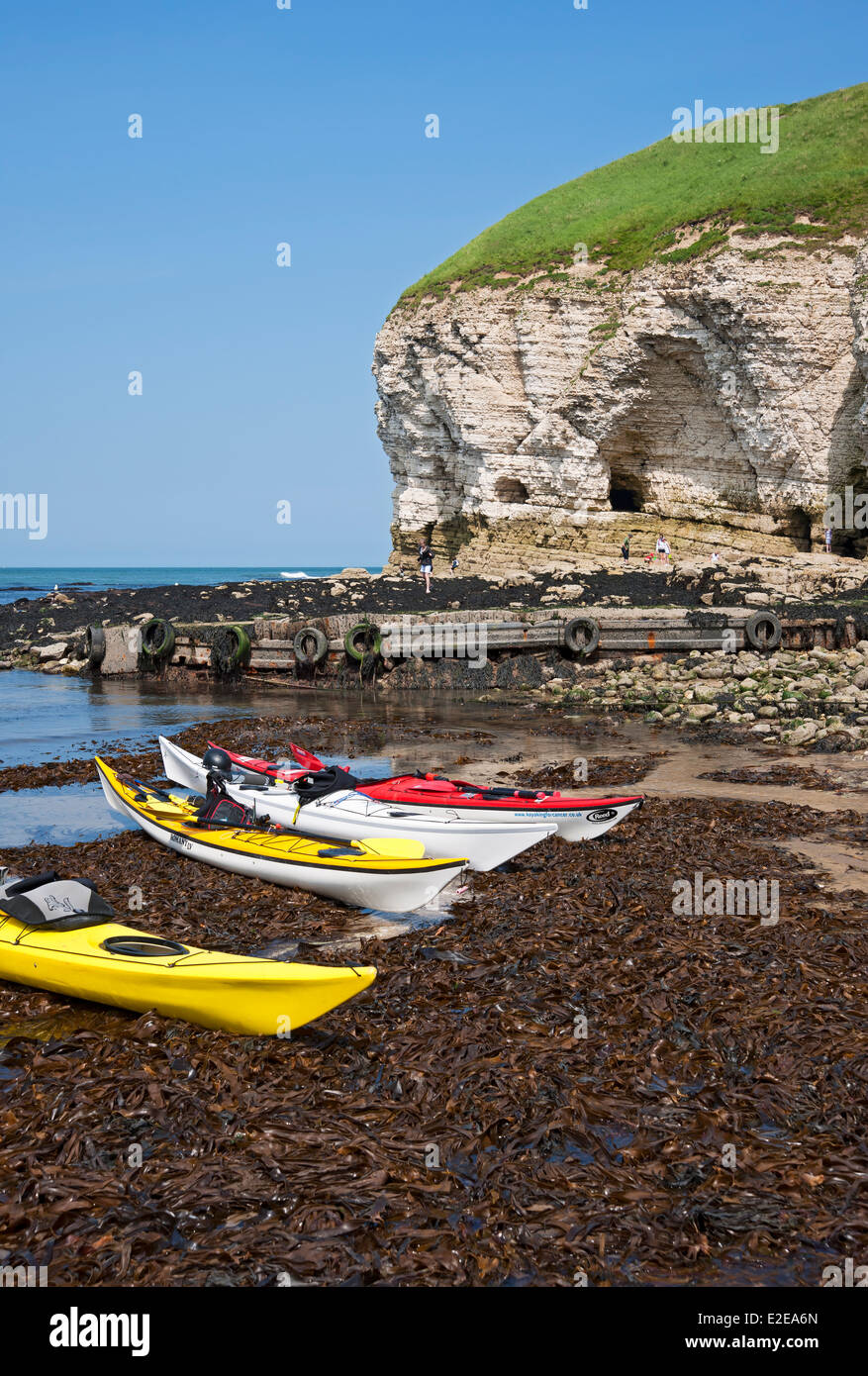 Kayaks kayak canoe canoes boat boats on the beach in summer North