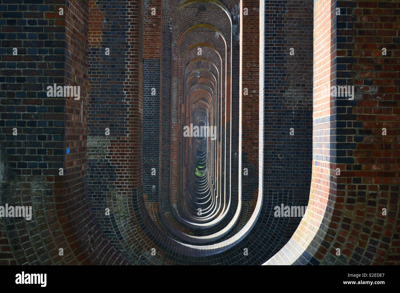 Brick railway viaduct arches from the Ouse Valley viaduct in Sussex, England. Stock Photo