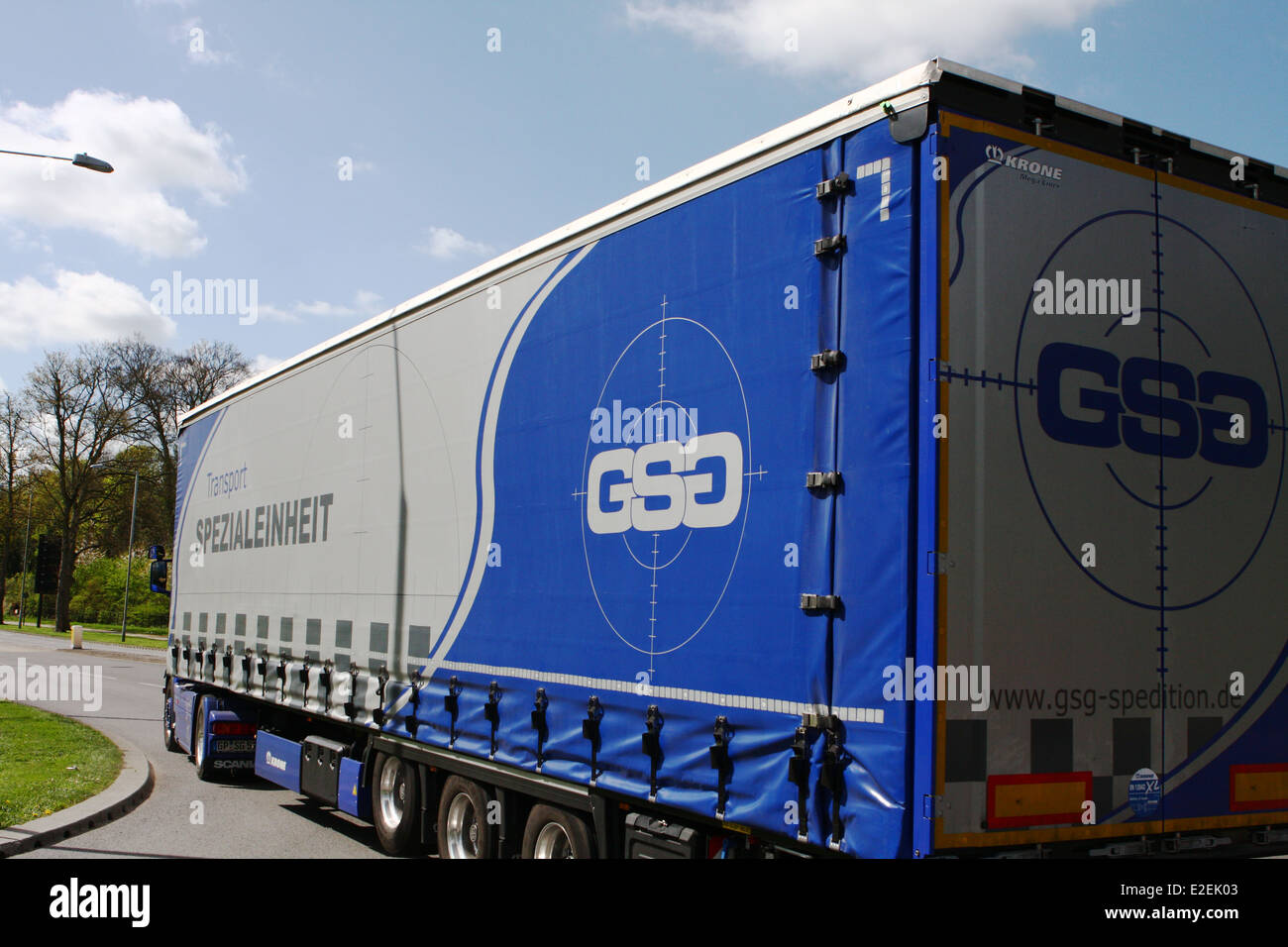 Rear view of a foreign truck exiting a roundabout in Coulsdon, Surrey, England Stock Photo
