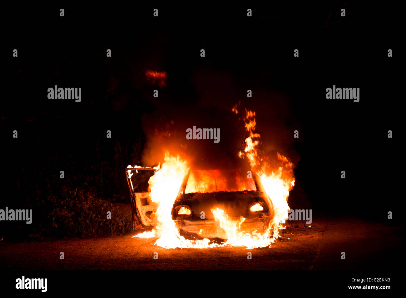 A car on fire at night Stock Photo - Alamy