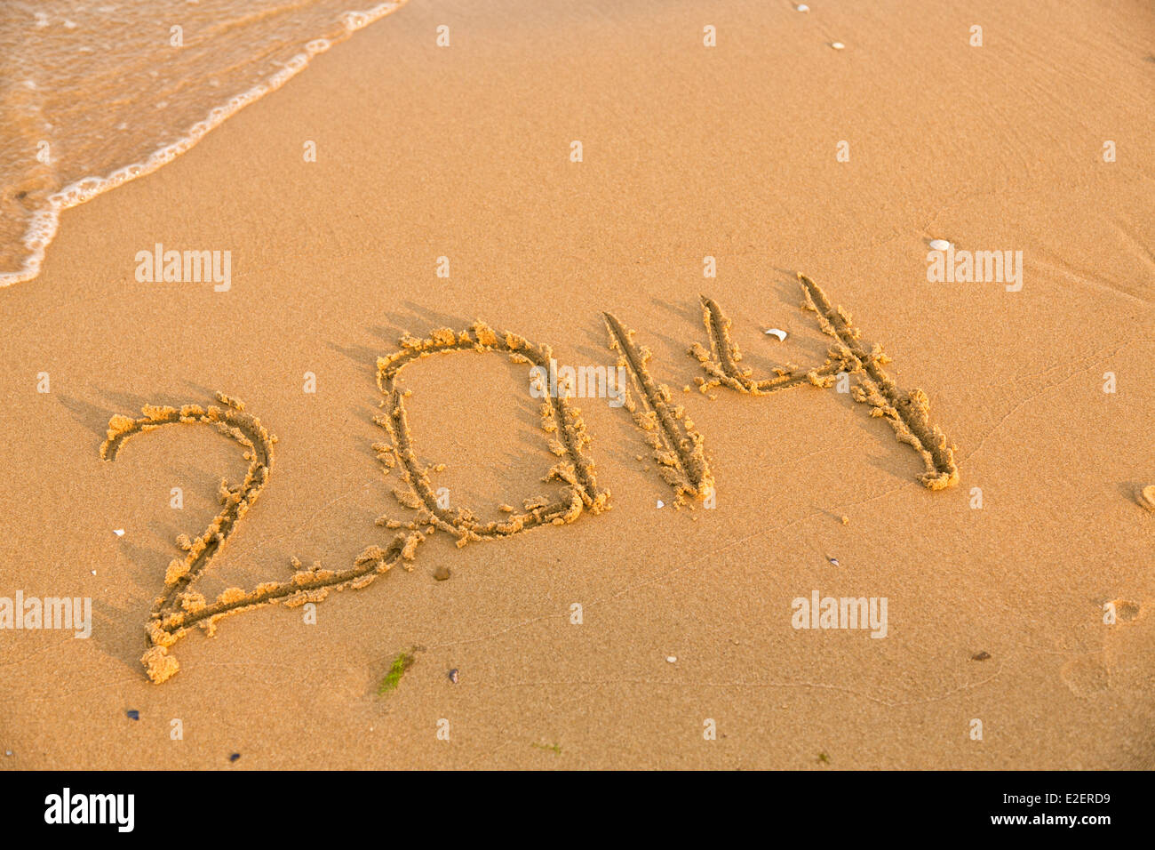 2014 numbers on the yellow sandy beach hi-res stock photography and ...