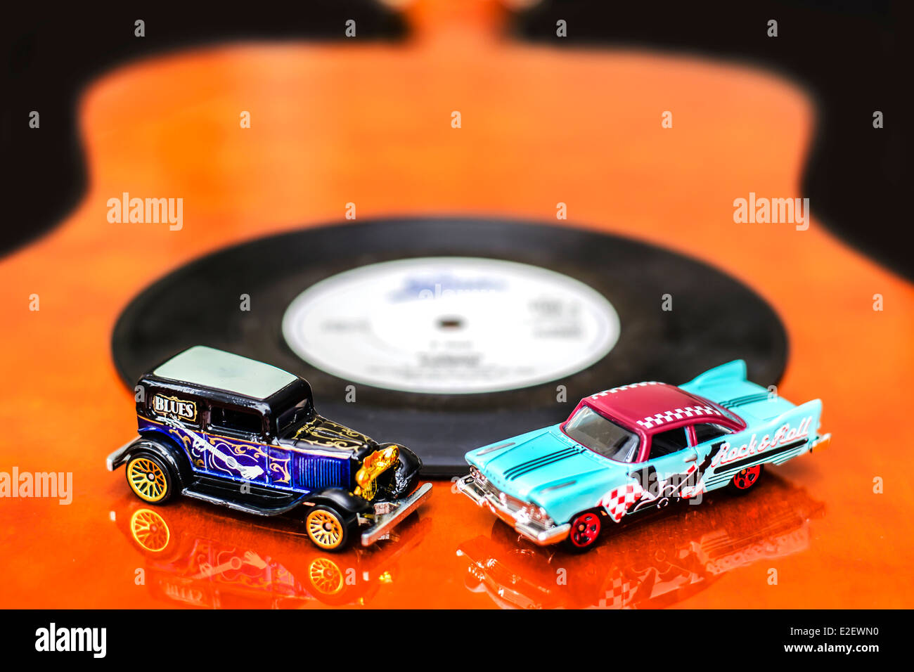 Blues and Rock Cars Miniature Toys on Guitar Stock Photo