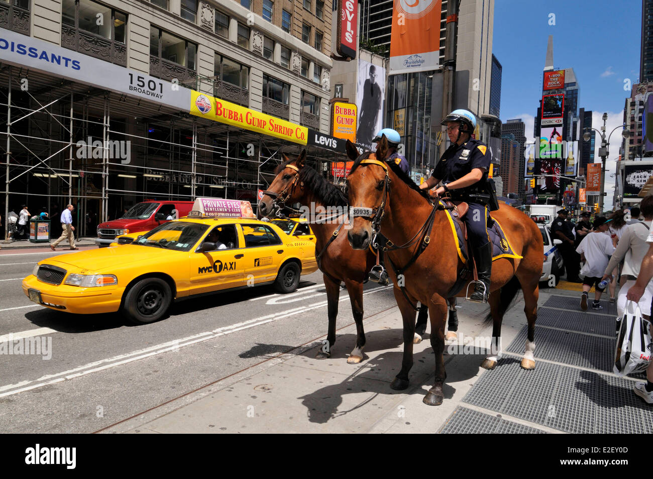 United States, New York, Times Square, yellow cab and mounted policemen Stock Photo