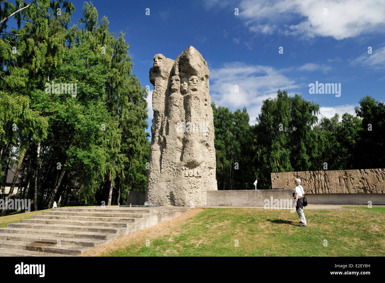 Poland, Pomerania, Sztutowo, concentration camp of Stutthof, Memorial built in 1968, man from behind looking at the sculpture Stock Photo